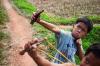 Cambodia Boys use sling shot